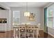 Charming dining room with hardwood floors, stylish decor, and plenty of natural light at 108 White Burley Ct, Durham, NC 27703