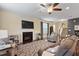 Inviting living room with a fireplace, hardwood floors, comfortable seating, and lots of natural light at 108 White Burley Ct, Durham, NC 27703
