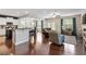 Spacious living room featuring hardwood floors, modern furniture, a fireplace and lots of natural light at 108 White Burley Ct, Durham, NC 27703
