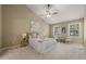 Comfortable bedroom features high ceilings, fan, natural light and neutral color scheme at 110 Benedum Pl, Cary, NC 27518