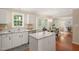 Bright kitchen features granite countertops, stainless steel appliances, island and eat-in breakfast nook at 110 Benedum Pl, Cary, NC 27518