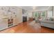 Bright living room with hardwood floors, a fireplace, and stylish decor at 110 Benedum Pl, Cary, NC 27518