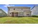 Backyard featuring a covered patio and a spacious green lawn at 1100 Balsawood Dr # 5, Durham, NC 27705
