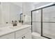 Bathroom with a modern vanity, white subway tile shower, and sleek glass enclosure at 1100 Balsawood Dr # 5, Durham, NC 27705