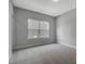 Neutral bedroom with carpet and natural light from a large window at 1100 Balsawood Dr # 5, Durham, NC 27705