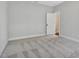 Empty bedroom with carpet and a white door at 1100 Balsawood Dr # 5, Durham, NC 27705