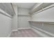 Walk-in closet with shelving for ample storage and soft carpeting at 1100 Balsawood Dr # 5, Durham, NC 27705
