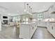Open kitchen with white cabinets, quartz countertops, and stainless steel appliances at 1100 Balsawood Dr # 5, Durham, NC 27705