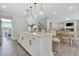 Open kitchen with white cabinets, quartz countertops, and stainless steel appliances at 1100 Balsawood Dr # 5, Durham, NC 27705
