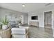 Open living room showcasing a cozy seating area, hardwood floors, and natural light at 1100 Balsawood Dr # 5, Durham, NC 27705