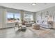 Spacious living room featuring hardwood floors, natural light, and comfortable seating at 1100 Balsawood Dr # 5, Durham, NC 27705