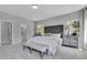 Serene bedroom features plush bedding, tufted headboard, bedside tables, and ensuite access at 1100 Balsawood Dr # 5, Durham, NC 27705