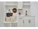 Functional mudroom with built-in storage, white cabinetry, and sink adds convenience at 1100 Balsawood Dr # 5, Durham, NC 27705