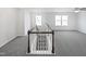 Bright bonus room featuring carpet floors, plenty of natural light and classic trim at 120 Martingale Dr, Holly Springs, NC 27540