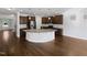 Bright open kitchen with granite countertops, stainless steel appliances, and hardwood floors at 120 Martingale Dr, Holly Springs, NC 27540