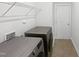 Modern laundry room equipped with new washer, dryer, and storage shelving at 120 Martingale Dr, Holly Springs, NC 27540