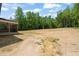 Vast backyard with lush trees, offering plenty of space for recreation and relaxation at 120 Pilot Ridge Rd, Zebulon, NC 27597