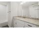 Elegant bathroom with granite countertop, modern fixtures, and a sleek, tiled shower-tub combination at 120 Pilot Ridge Rd, Zebulon, NC 27597