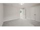 Cozy bedroom featuring soft carpeting, a window offering natural light, and a spacious closet for ample storage at 120 Pilot Ridge Rd, Zebulon, NC 27597