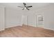 Spacious bedroom features a ceiling fan, neutral paint, trim, and light wood flooring at 120 Pilot Ridge Rd, Zebulon, NC 27597