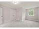 Serene bedroom highlighting plush carpeting, a window with views, and a sizable closet for organized storage at 120 Pilot Ridge Rd, Zebulon, NC 27597