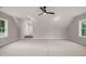 Expansive bedroom with soft carpeting, generous natural light, and a stylish ceiling fan for added comfort at 120 Pilot Ridge Rd, Zebulon, NC 27597