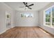 Spacious bedroom with hardwood floors, wainscoting, large windows, and an ensuite bathroom at 120 Pilot Ridge Rd, Zebulon, NC 27597