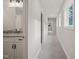 Bright hallway featuring neutral walls, plush carpeting, and natural light streaming through the windows at 120 Pilot Ridge Rd, Zebulon, NC 27597