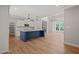 Bright kitchen with an island, stainless appliances, and open to living room at 120 Pilot Ridge Rd, Zebulon, NC 27597