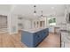 Spacious kitchen featuring a large island with granite countertops, ample storage, and stainless appliances at 120 Pilot Ridge Rd, Zebulon, NC 27597