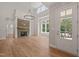 Bright living room featuring a stone fireplace, hardwood floors, and ample natural light at 120 Pilot Ridge Rd, Zebulon, NC 27597