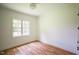 Bedroom featuring hardwood floors and a large window at 1212 Perry Bluff Dr, Wake Forest, NC 27587
