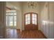 Elegant foyer with hardwood floors, wainscoting, and a double-door entrance at 1212 Perry Bluff Dr, Wake Forest, NC 27587