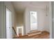 Hallway featuring hardwood floors and access to other rooms at 1212 Perry Bluff Dr, Wake Forest, NC 27587