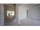 Interior view of rooms with fresh white paint and unfinished wood beams, partially covered with protective plastic at 1212 Perry Bluff Dr, Wake Forest, NC 27587
