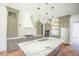 Spacious kitchen with a marble island, gas range, and custom cabinets at 1212 Perry Bluff Dr, Wake Forest, NC 27587