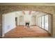 Spacious living room featuring hardwood floors, a fireplace, and built-in bookshelves at 1212 Perry Bluff Dr, Wake Forest, NC 27587