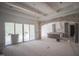 Living room with a fireplace and built-in shelves is under construction with protective plastic coverings at 1212 Perry Bluff Dr, Wake Forest, NC 27587