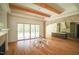 Open living area with hardwood floors, a fireplace, and access to the kitchen at 1212 Perry Bluff Dr, Wake Forest, NC 27587