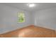 Bright bedroom featuring hardwood floors, natural light, and a serene atmosphere at 129 Castle Dr, Smithfield, NC 27577