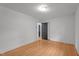 Neutral bedroom offers hardwood floors, fresh white walls, and classic trim at 129 Castle Dr, Smithfield, NC 27577