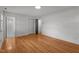 Large bedroom with hardwood floors, an en-suite bathroom, and closet at 129 Castle Dr, Smithfield, NC 27577