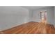 Neutral bedroom featuring hardwood floors and a walk-in closet at 129 Castle Dr, Smithfield, NC 27577