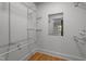 Organized walk-in closet with wire shelving and a mirror reflecting the interior at 129 Castle Dr, Smithfield, NC 27577