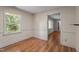 Sunny dining room featuring classic wallpaper and hardwood floors at 129 Castle Dr, Smithfield, NC 27577