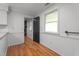 Dining area with white wainscoting, and hardwood flooring at 129 Castle Dr, Smithfield, NC 27577