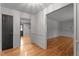Bright entryway featuring hardwood floors, classic wallpaper, and neutral trim at 129 Castle Dr, Smithfield, NC 27577