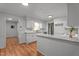 Bright kitchen featuring white cabinets, granite counters, subway tile backsplash and stainless steel appliances at 129 Castle Dr, Smithfield, NC 27577