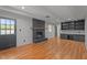 Spacious living room featuring wood-look floors and black brick fireplace at 129 Castle Dr, Smithfield, NC 27577