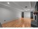 Spacious living room featuring wood-look floors and black brick fireplace at 129 Castle Dr, Smithfield, NC 27577
